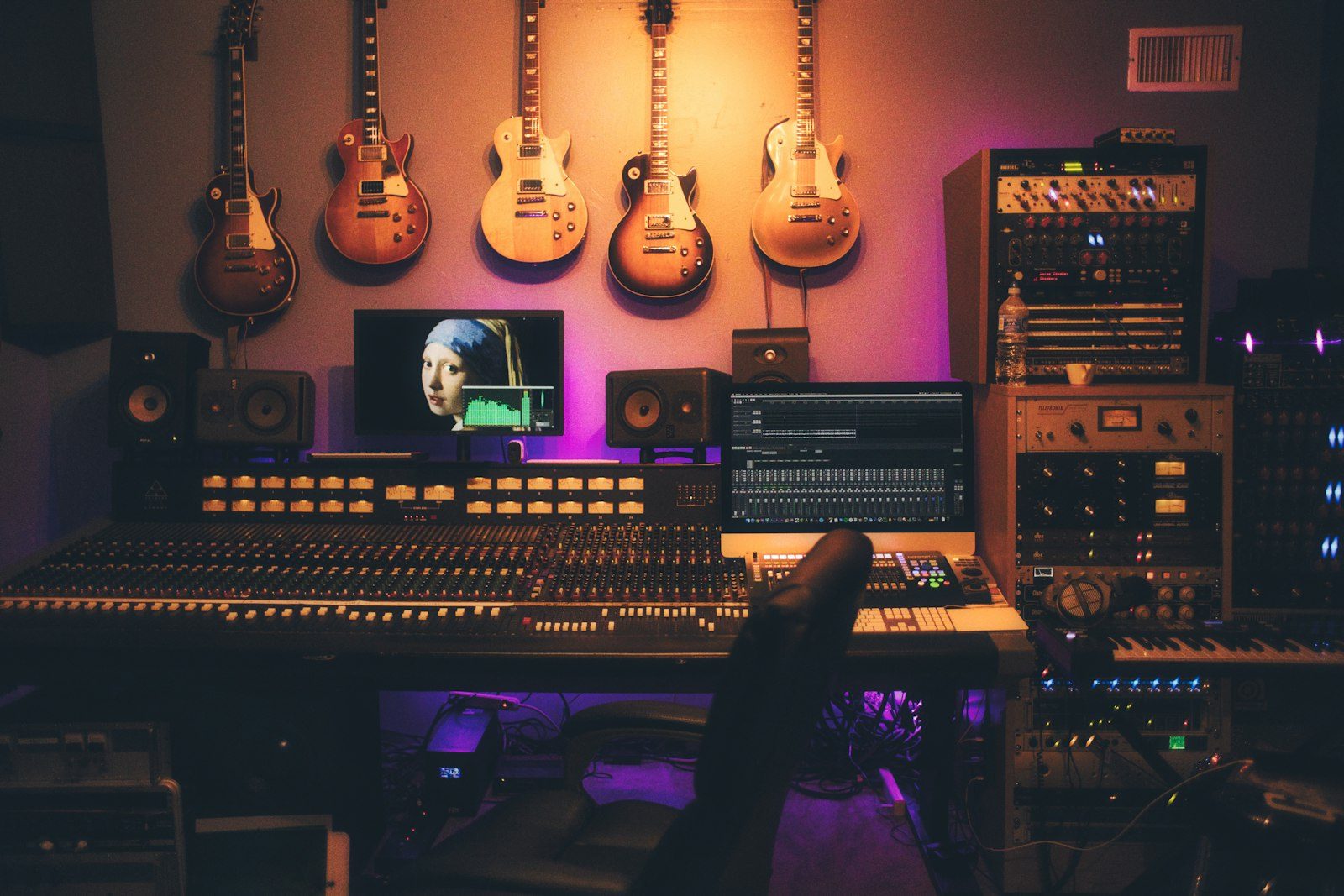 Recording studio bathed in pink and gold light